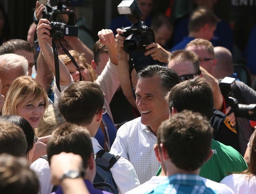 LEAH HOGSTEN  |  The Salt Lake Tribune
Mitt Romney is surrounded by supporters on Friday during his one public appearance of the trip -- at the Hires Big H Drive-in in Salt Lake City. Advisers to the former Olympics chief are pushing to move up Utah's primary on 2012 calendar.